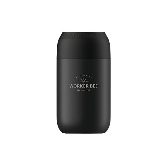 The Worker Bee Chillys Reusable Cup - Black (12oz) features a matte black finish, rounded top, and white Worker Bee Tea & Coffee logo with a bee graphic—an eco-friendly insulated cup ideal for keeping drinks hot or cold every day.