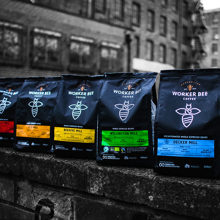 Worker Bee Coffee bags, Multiple Flavors on a wall