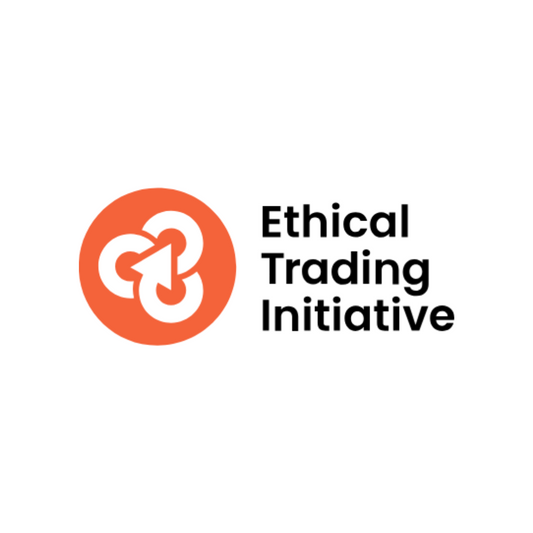 Ethical Trading Initiative logo with an orange circle and white design on a white background