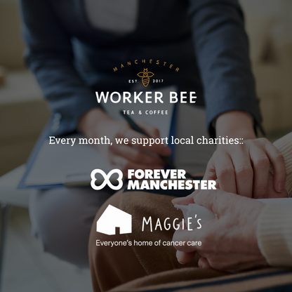 Two people sitting together with a Manchester Worker Bee logo and support for local charities displayed.