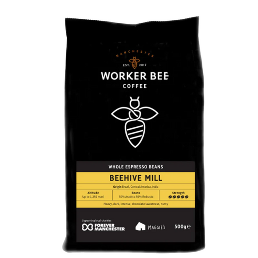 A 500g bag of Beehive Mill Espresso Beans from Worker Bee Tea & Coffee. This whole bean blend features a bee logo, details on origin, altitude, flavors, and charities. Contains a 50/50 mix of Arabica and Robusta beans.